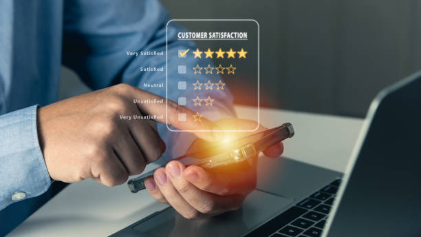 istock Customer satisfaction, business using smartphone to feedback service or survey concept, 5 stars satisfaction. 1458077112