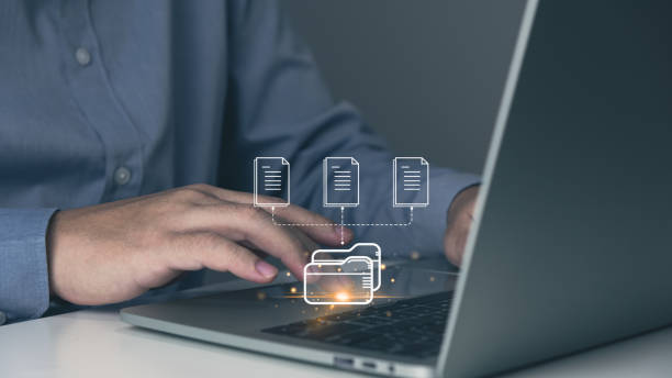 istock File management, businessman working with laptop and virtual screen, online documentation database, IT consultant, software for archiving corporate files. 1458077117