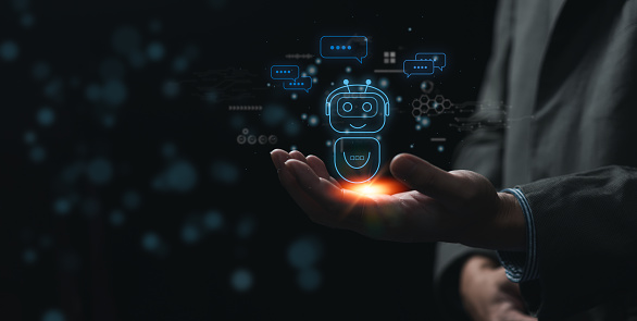 Businessman holding a light chatbot hologram intelligence AI. Digital chatbot, robot application.chat with AI Artifice intelligent developers digital technology concept.