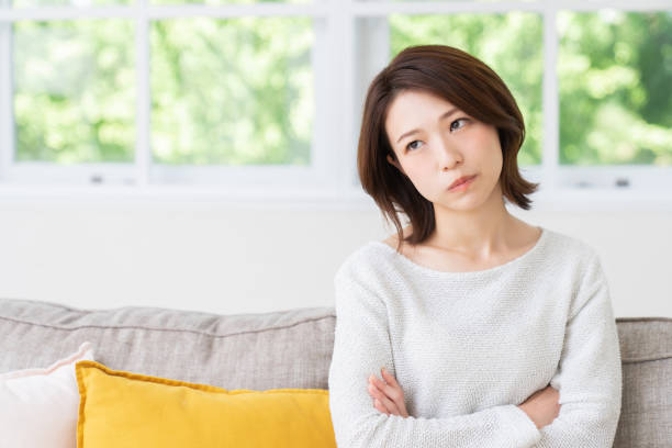 attractive asian woman , think