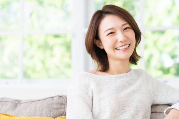 attractive asian woman relaxing - woman smiling stockfoto's en -beelden