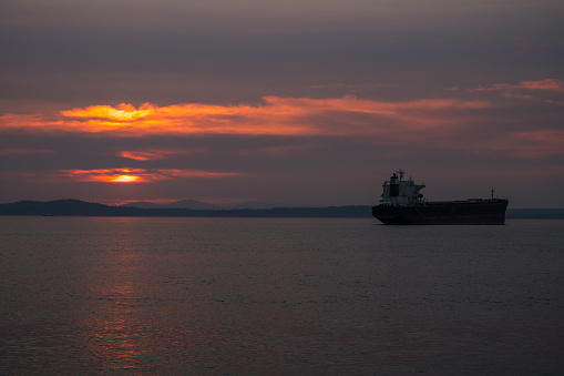 Sunset over Elliott bay from the bolt creek fire with a large shipping tanker.