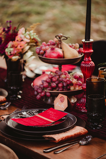 Bright colored rustic table setting at a wedding