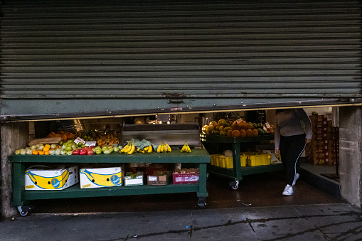 Seattle, USA - Oct 1st, 2022: A vendor closing up late in the day in Pike Place.