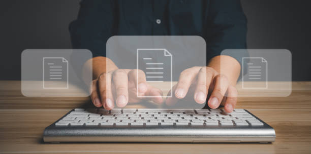 istock Businessman working on virtual screen of Document Management System (DMS). Software for archiving, searching, and managing corporate files and information, documentation in enterprise with ERP. 1458089858