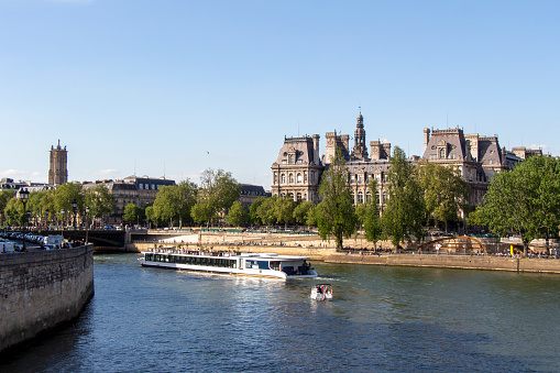 Paris : boat trip on Seine – Vedettes de Paris – during pandemic Covid 19 virus in France. Usually crowd in summer, Bateaux mouches are empty, with less tourists.