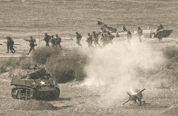 WW2 D Day Battle on Omaha Beach US soldiers invading Omaha Beach on D Day battle stock pictures, royalty-free photos & images