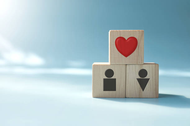 istock Love message symbol in wooden blocks on blue background 1458096905