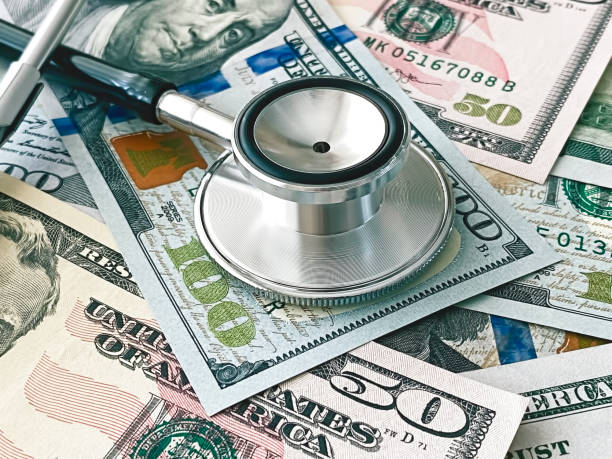 financial surveillance - currency stethoscope medicare usa imagens e fotografias de stock