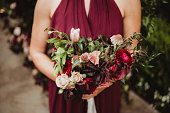 Bridesmaid holding wedding bouquet