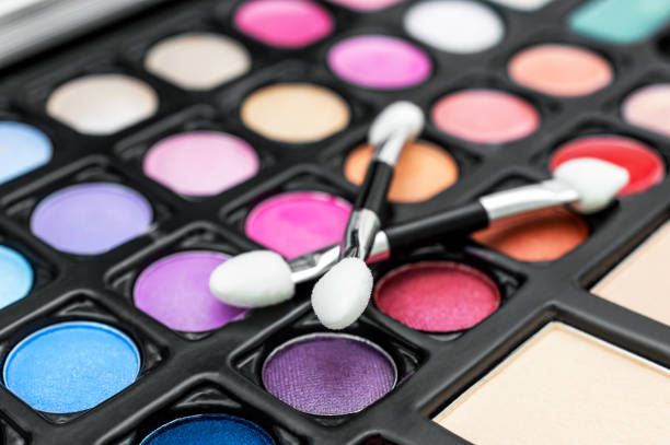 istock Brushes for makeup on palette of eyeshadows. Close up. 1458105278