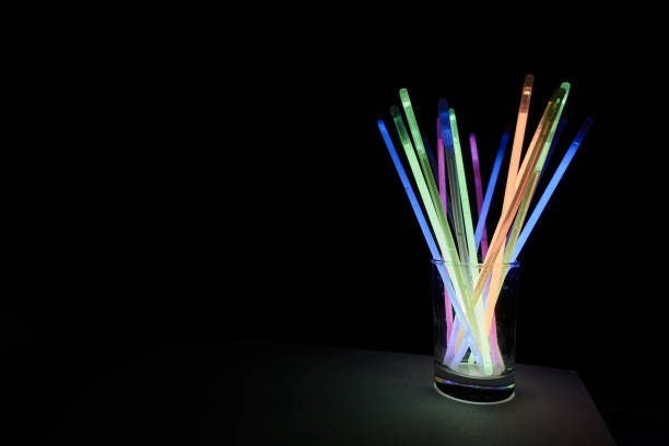 istock arrangement of multi-colored glow sticks against a black background 1458106895