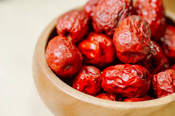 fresh korean jujube fruit in wood bowl