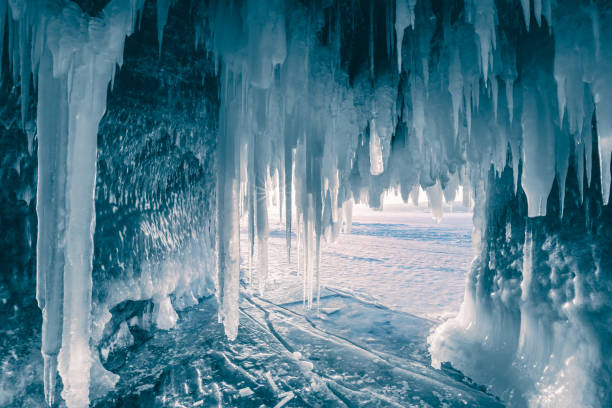 Inside the turquoise ice cave - ice cave winter frozen nature background landscape - Lake Baikal, Siberia, Eastern Russia