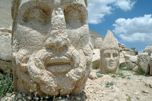 Giant God heads on Mount Nemrut. Anatloia, Turkey Giant God heads on Mount Nemrut. Anatolia, Turkey. Ancient colossal stone statues representing legendary mythological figures nemrut dagi stock pictures, royalty-free photos & images