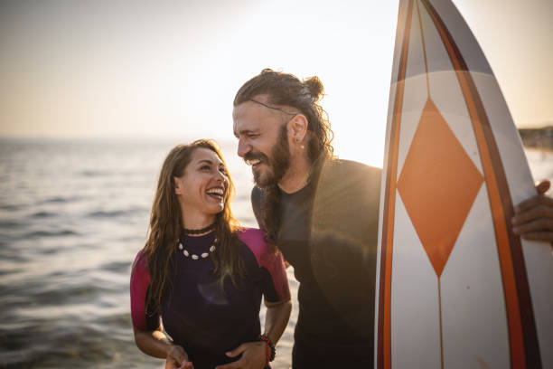istock Surfers having fun at the beach 1458130227
