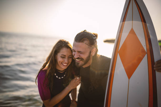 istock Surfers having fun at the beach 1458131209