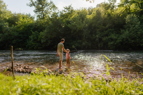 istock Father and son fishing together 1458134498