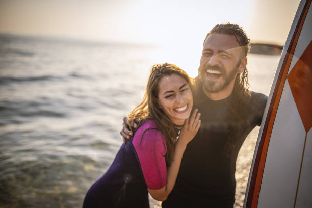 istock Surfers having fun at the beach 1458134888