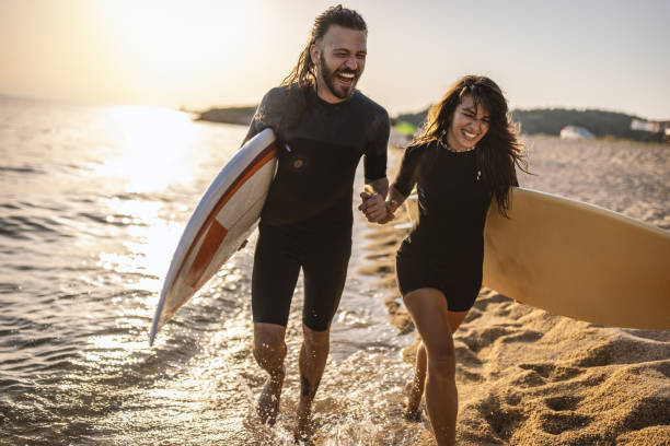 istock Surfers at the beach 1458135106