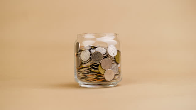 Saving money in a glass jar