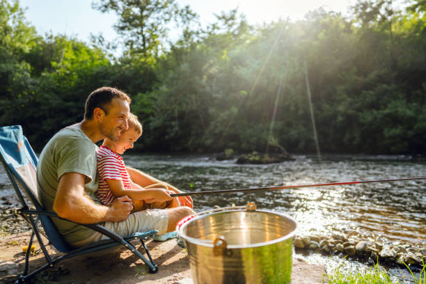 istock Father and son fishing together 1458137232