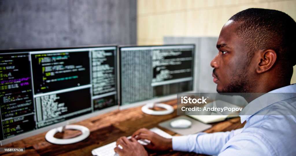 African American Coder Using Computer At Desk Stock Photo - Download ...