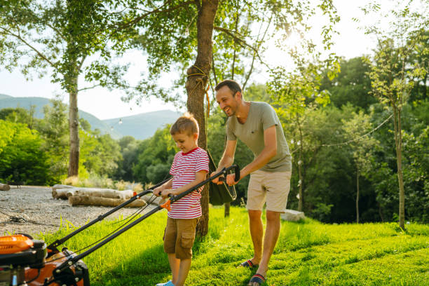 istock Mowing the lawn together 1458137672