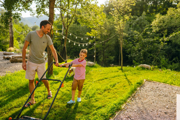 istock Mowing the lawn together 1458138117