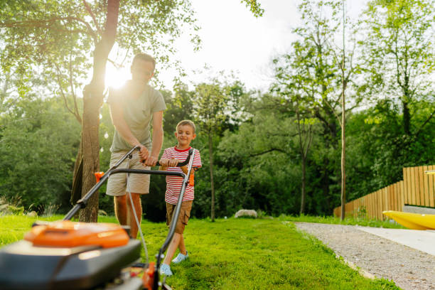 istock Mowing the lawn together 1458139659