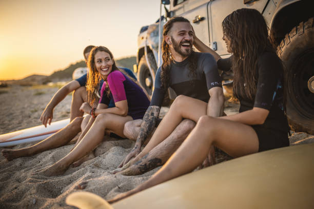 istock Surfers having fun at the beach 1458139703
