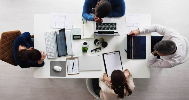 istock Group Of Businesspeople Sitting 1458140466
