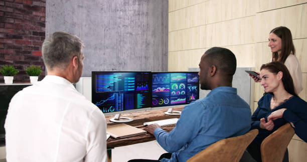 istock Financial Analysis Dashboard Meeting. Pointing At Report 1458141405