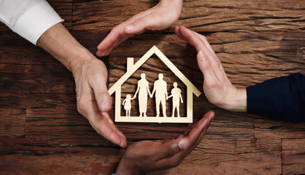 istock Protecting Family Paper Cut Out With Hands 1458141698
