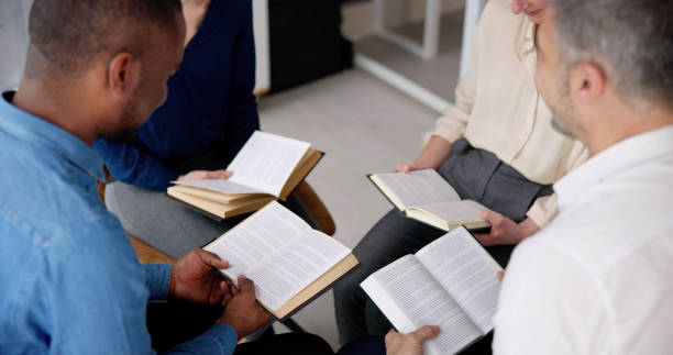 istock Group Of Multiethnic Friends Reading Bible 1458141933