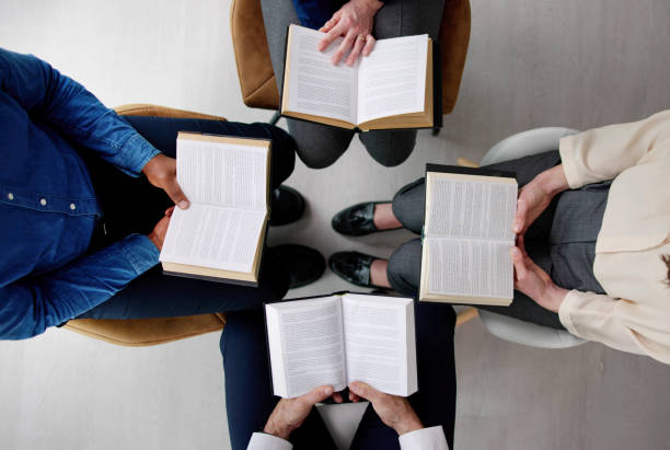 istock Group Of Multiethnic Friends Reading Bible 1458141966