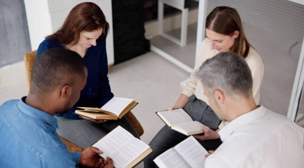 istock Group Of Multiethnic Friends Reading Bible 1458141973