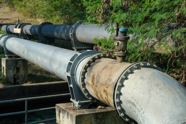 istock Pipe is installed along the bridge on the pipe support. Water steel pipes for community utilities. 1458143607