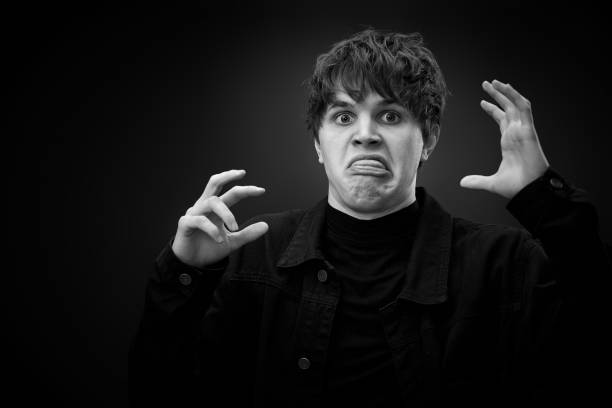 istock crazy young man with awesome hairdo grimacing 1458148170