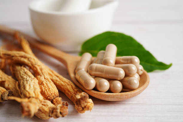 istock Ginseng roots and green leaf, healthy food. 1458149249
