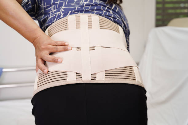 istock Asian senior wearing elastic support belt can help reduce back pain. 1458152850