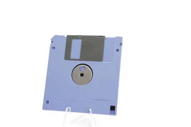 Photo of The image shows a detail of the back of a purple retro floppy disk with a capacity of 1.44 megabytes (megabytes) on a white background.