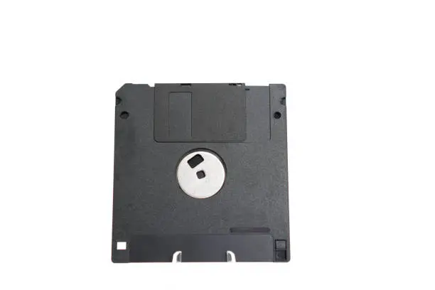 Photo of The image shows a detail of the back of a retro floppy disk with a capacity of 1.44 megabytes (megabytes) on a white background.