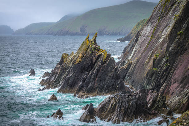 The waves crashing into the cliffs, this is the Dingle Peninsula on Ireland’s Wild Atlantic Way, southwest Atlantic coast.