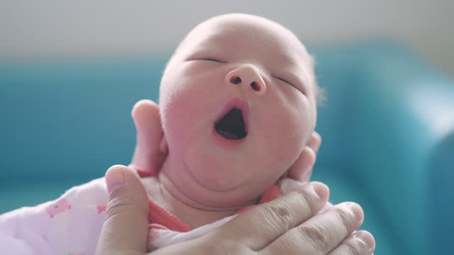 Little baby newborn yawning time to sleep
