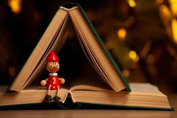 Photo of image of wooden toy book dark background