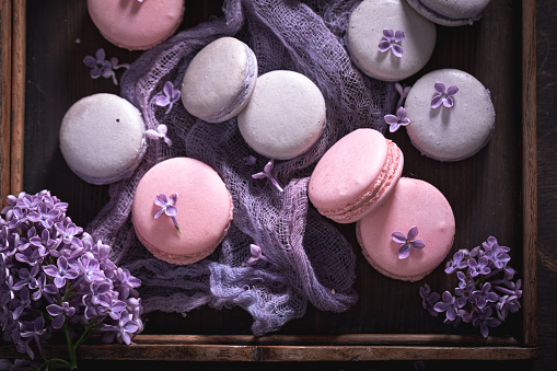 Gorgeous and delicious elderberry flavored macaroons. Beautiful background for a gift card. Unique dessert arrangement.