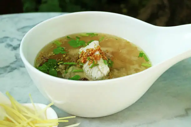 Photo of Bowl of Delectable Chinese Style Rice Porridge with Fish