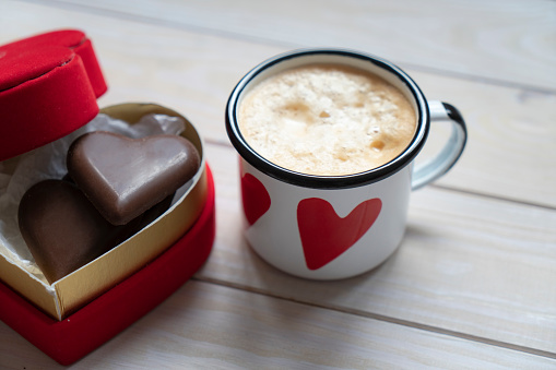 sweet gift for Valentine's Day with your own hands. A gift for the holiday made of heart-shaped candies and marshmallows.