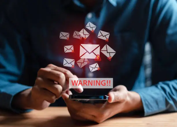 Photo of Email spam virus warning caution sign for notification on internet letter security protect, junk and trash mail, Cybersecurity vulnerability, data breach, illegal connection, compromised information.